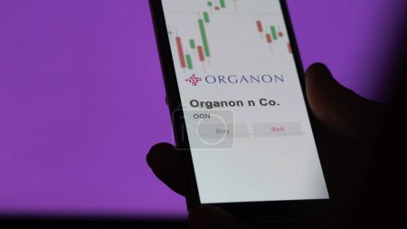 Photo for The logo of Organon & Co. on the screen of an exchange. Organon & Co  price stocks, $OGN on a device. - Royalty Free Image