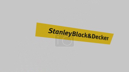Téléchargez les photos : Le logo de Stanley Black & Decker sur un mur blanc d'écrans. Stanley Black & Decker marque sur un appareil. - en image libre de droit