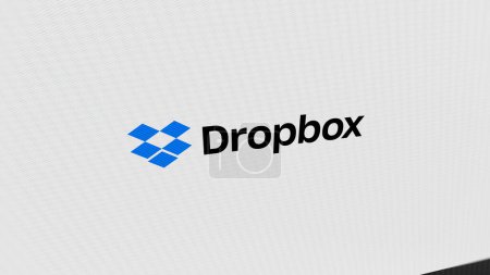 Photo for The logo of Dropbox on a giant white screen, the brand Dropbox on a device. - Royalty Free Image