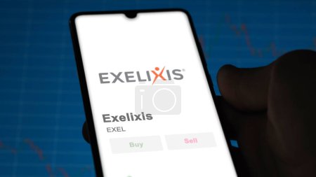 Photo for The trading page of Exelixis on a stock exchange, a shareholder analyzing $EXEL, Exelixis, on a device. - Royalty Free Image