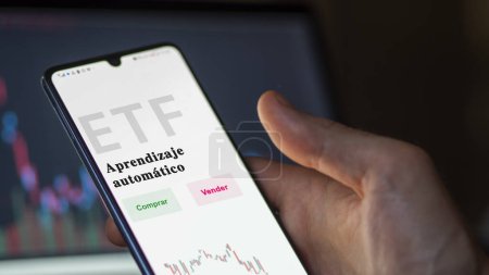 Photo for An investor analyzing an etf fund. ETF text in Spanish : Machine Learning, buy, sell. - Royalty Free Image