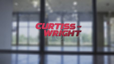 Foto de 20 de noviembre de 2023. El logotipo de Curtiss-Wright en la ventana de un pasillo en un distrito de negocios.. - Imagen libre de derechos