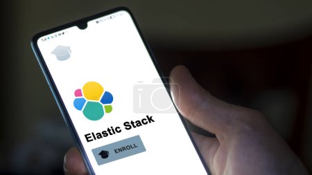 Photo for January 03th 2024. Student enrolls to Elastic Stack program on a phone, upskilling certification by e-learning - Royalty Free Image