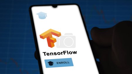 Photo for January 03th 2024. Student enrolls to TensorFlow program on a phone, upskilling certification by e-learning - Royalty Free Image