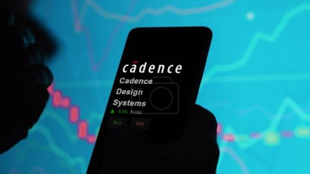 Photo for January 15th 2024. The logo of Cadence Design Systems on the screen of an exchange. Cadence Design Systems price stocks, $CDNS on a device. - Royalty Free Image