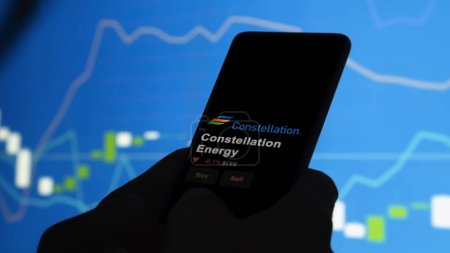 Photo for January 15th 2024. The logo of Constellation Energy on the screen of an exchange. Constellation Energy price stocks, $CEG on a device. - Royalty Free Image