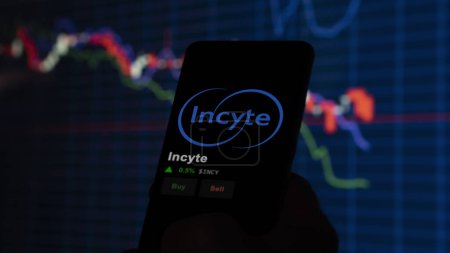 January 15th 2024. The logo of Incyte on the screen of an exchange. Incyte price stocks, $INCY on a device.