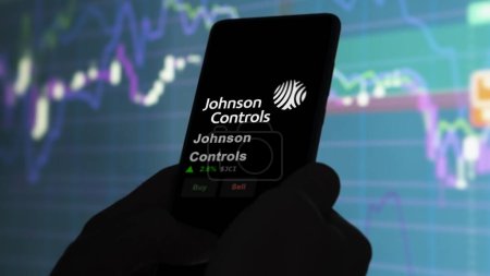 Photo for January 15th 2024. The logo of Johnson Controls on the screen of an exchange. Johnson Controls price stocks, $JCI on a device. - Royalty Free Image