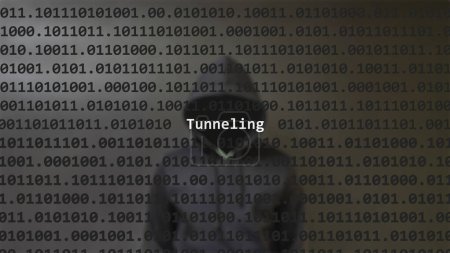 Cyber attack tunneling text in foreground screen, anonymous hacker hidden with hoodie in the blurred background. Vulnerability text in binary system code on editor program.