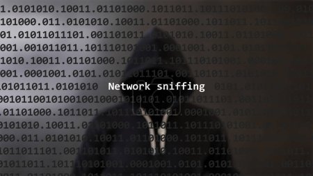 Cyber attack network sniffing text in foreground screen, anonymous hacker hidden with hoodie in the blurred background. Vulnerability text in binary system code on editor program.