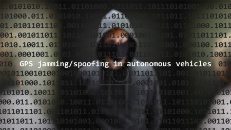 Cyber attack gps jamming/spoofing in autonomous vehicles text in foreground screen, anonymous hacker hidden with hoodie in the blurred background. Vulnerability text in binary system code on editor program.