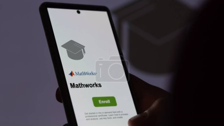 Photo for March 04th 2024. Student enrolls to mathworks program on a phone, upskilling certification by e-learning - Royalty Free Image