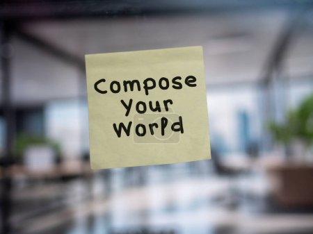 Post note on glass with 'Compose Your World'.