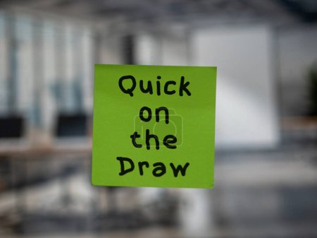 Post note on glass with 'Quick on the Draw'.