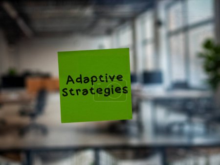 Post note on glass with 'Adaptive Strategies'.
