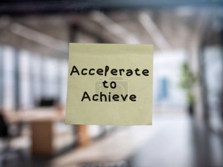 Post note on glass with 'Accelerate to Achieve'.