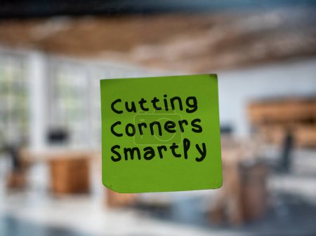 Post note on glass with 'Cutting Corners Smartly'.