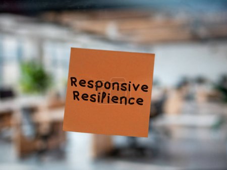Post note on glass with 'Responsive Resilience'.