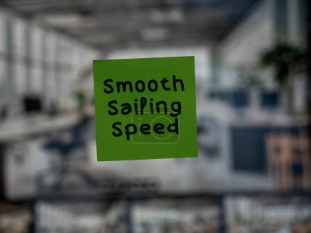 Post note on glass with 'Smooth Sailing Speed'.