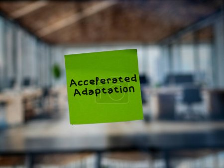 Post note on glass with 'Accelerated Adaptation'.