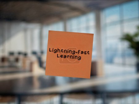 Post note on glass with 'Lightning-Fast Learning'.