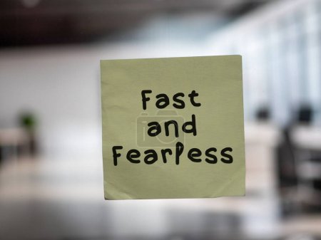 Post note on glass with 'Fast and Fearless'.