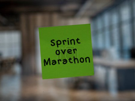 Post note on glass with 'Sprint over Marathon'.