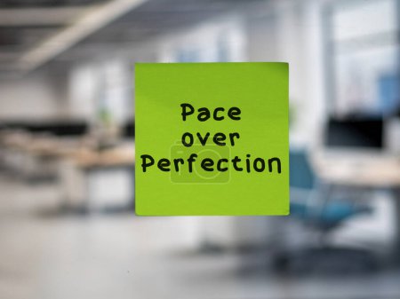 Post note on glass with 'Pace over Perfection'.