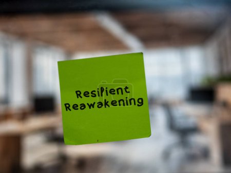 Post note on glass with 'Resilient Reawakening'.