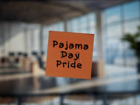 Post note on glass with 'Pajama Day Pride'.