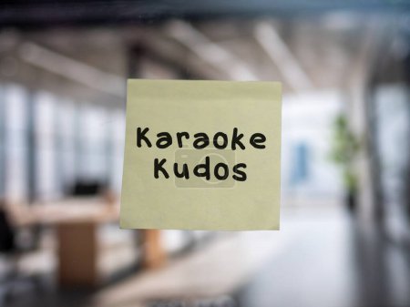 Photo for Post note on glass with 'Karaoke Kudos'. - Royalty Free Image