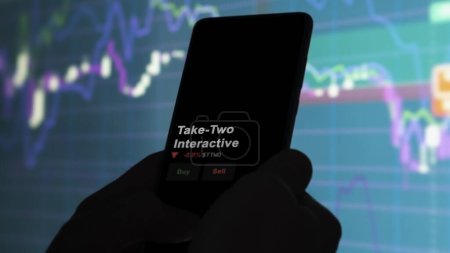 Photo for January 15th 2024. The logo of Take-Two Interactive on the screen of an exchange. Take-Two Interactive price stocks, $TTWO on a device. - Royalty Free Image