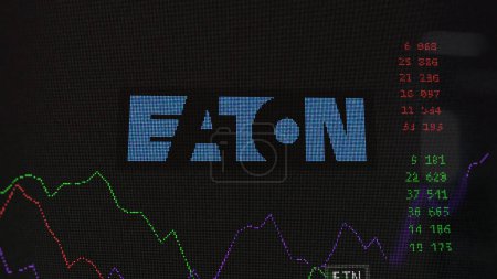 Photo for March 19th 2024. The logo of Eaton Corporation on the screen of an exchange. Eaton Corporation price stocks, $ETN on a device. - Royalty Free Image