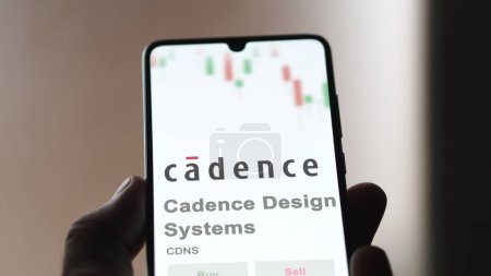 Photo for April 04th 2024. The logo of Cadence Design Systems on the screen of an exchange. Cadence Design Systems price stocks, $CDNS on a device. - Royalty Free Image