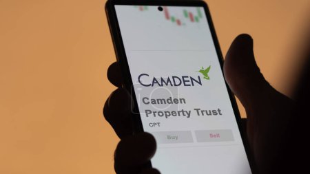 Photo for April 04th 2024. The logo of Camden Property Trust on the screen of an exchange. Camden Property Trust price stocks, $CPT on a device. - Royalty Free Image