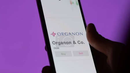 Photo for April 04th 2024. The logo of Organon n Co. on the screen of an exchange. Organon & Co  price stocks, $OGN on a device. - Royalty Free Image