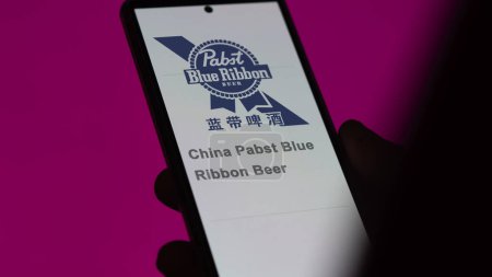 Photo for April 17th 2024 , Shanghai, China. Close up on logo of China Pabst Blue Ribbon Beer on the screen of an exchange. China Pabst Blue Ribbon Beer price stocks, $ on a device. - Royalty Free Image