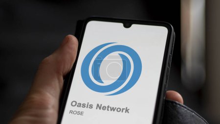Photo for April 17th 2024 , Shanghai, China. Close up on logo of (ROSE) Oasis Network on the screen of an exchange. (ROSE) Oasis Network price stocks, $ROSE on a device. - Royalty Free Image
