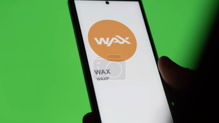 Photo for April 20th 2024 , Shanghai, China. Close up on logo of (WAXP) WAX on the screen of an exchange. (WAXP) WAX price stocks, $WAXP on a device. - Royalty Free Image