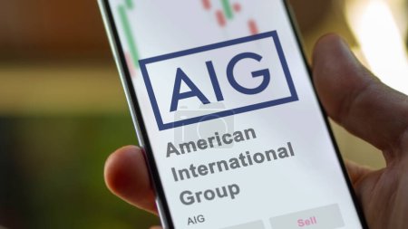 Photo for April 09th 2024 , New York City, New York. Close up on logo of American International Group on the screen of an exchange. American International Group price stocks, $AIG on a device. - Royalty Free Image