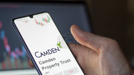 Photo for April 09th 2024 , Houston, Texas. Close up on logo of Camden Property Trust on the screen of an exchange. Camden Property Trust price stocks, $CPT on a device. - Royalty Free Image