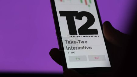 Photo for April 09th 2024 , New York City, New York. Close up on logo of Take-Two Interactive on the screen of an exchange. Take-Two Interactive price stocks, $TTWO on a device. - Royalty Free Image