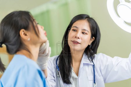 Photo for Asian woman consulting about Cosmetic surgeon and make Botox injections on face for beauty procedures. Plastic surgery in face of woman - Royalty Free Image