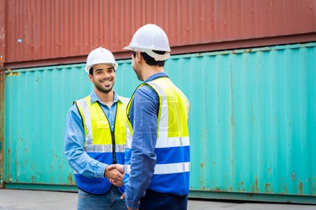 Photo for Two male engineers in a container shipping company Consulting to check the order for the container that is responsible - Royalty Free Image
