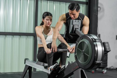 Photo for Asian men and women Have a strong body, good health, love to exercise. They are exercising together at the gym having fun. - Royalty Free Image