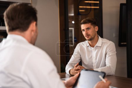 Photo for Male mature caucasian ceo businessman leader with diverse coworkers team executive managers group meeting. Multicultural professional businesspeople working together on research plan boardroom. - Royalty Free Image