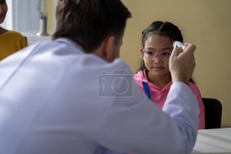 Photo for Male doctor and girl young patient Talk and give advice about your illness at the hospital. - Royalty Free Image