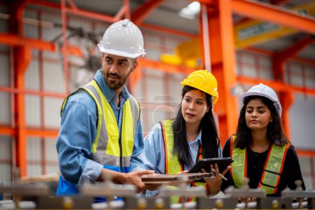 Photo for Team of young male and female engineers in a metal sheet factory Responsible work is being inspected at the actual work site. Work professionally and happily - Royalty Free Image