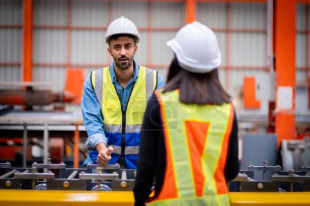 Photo for Young male engineer in metal sheet factory Responsible work is being inspected at the actual work site. Work professionally and happily - Royalty Free Image