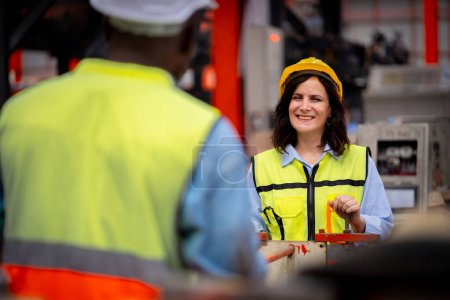 Photo for Young female engineer in metal sheet factory Responsible work is being inspected at the actual work site. Work professionally and happily - Royalty Free Image